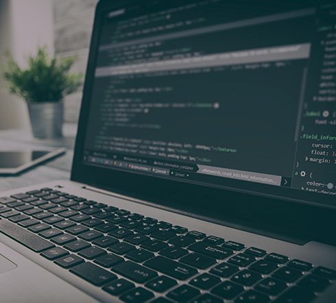 image of a computer with code on the screen